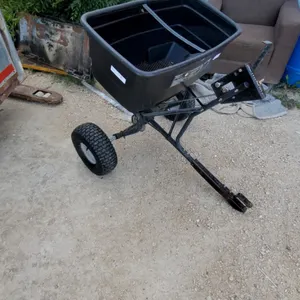 Agri-Fab Tow-Behind Broadcast Spreader with Black Plastic Hopper and Pneumatic Tires