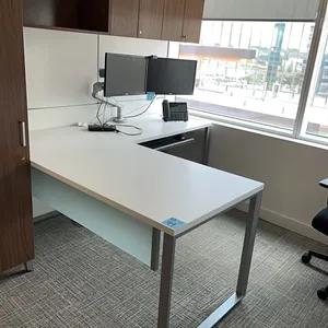 L-shaped desk, wooden with metal legs and glass accent, keyboard tray and wooden wall-mounted hutch cupboard