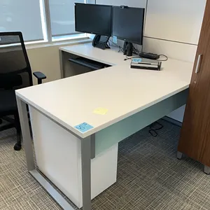 L-shaped desk, wooden with metal legs and glass accent, keyboard tray, white filing cabinet, and wooden wall-mounted hutch cupboard