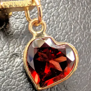 10K GARNET (0.85CT) PENDANT, SUGGESTED RETAIL VALUE $400