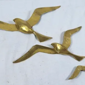 Brass flying seagulls