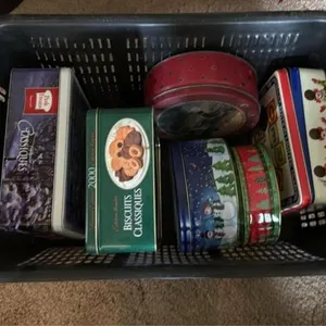 Tote with assorted Christmas tins