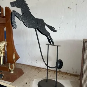 Steel balancing horse sign