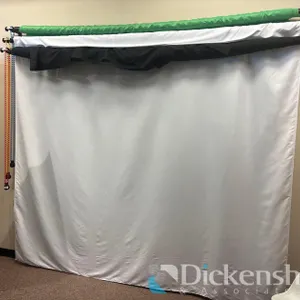 WHITE, BLACK, AND GREEN BACKDROPS ON MOUNTED ROLLERS
