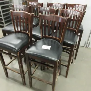 Eight black and brown bar stools