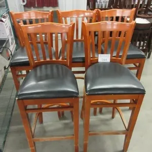 Five black and tan bar stools