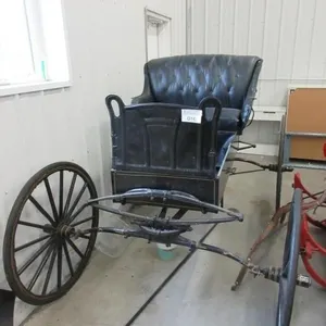 Black antique horse-drawn buggy