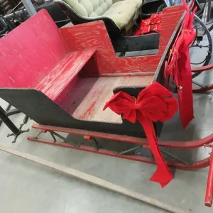 Antique black and red wooden sleigh