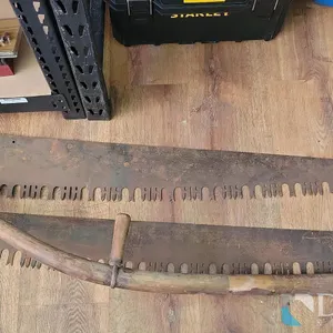 (2) VINTAGE CROSSCUT SAWS, (1) VINTAGE SICKLE WITH WOODEN HANDLE