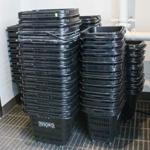APPROXIMATELY 70 POLY GROCERY BASKETS W/ CASTERS