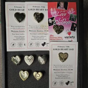 Assortment of "Gold Heart Day" pins