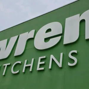 Wren Kitchens illuminated storefront signage letters. White dimensional building letters spelling 'wren KITCHENS'. Note: Buyer is solely responsible f