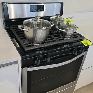 Whirlpool WFG320M0BS3 gas range. Features black and stainless steel finish, 4 burners with continuous grates, and oven with window door and single rac