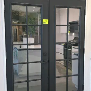 Set of French doors. Features a 10-lite glass pane design on each door with a dark gray finish. Includes matching lever handle and deadbolt. 60"W x 80