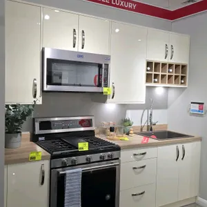 Infinity Plus 99"L cabinet set in Ultra Gardenia Gloss finish. Features laminate wood countertops, single-bowl sink, spring-neck faucet, and a wooden 