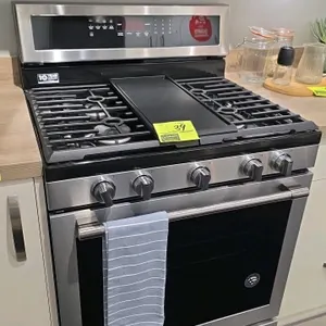 Maytag MGR8800FZ0 30" gas range. Features stainless steel construction, 5-burner cooktop with center griddle, oven with racks, digital control panel, 