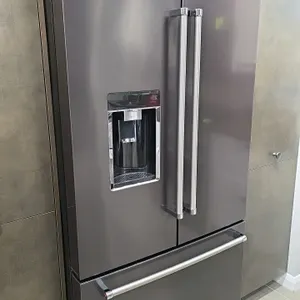KitchenAid KRFC704FBS03 French door refrigerator freezer. Features black stainless steel finish, indoor water and ice dispenser, bottom pull-out freez