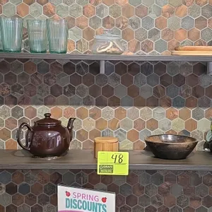 Quantity of kitchen and home smallwares. Includes assorted glassware, ceramic plates and bowls, a fluted baking dish, wooden pepper mill, canisters, a