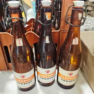 12 amber beer bottles w/porcelain snap tops
