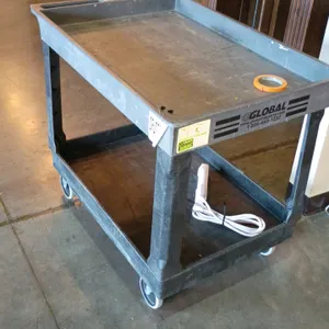 Global Industrial 2-tier poly rolling utility cart. Features durable plastic construction, two deep tub shelves, and a molded-in handle. Mounted on fo