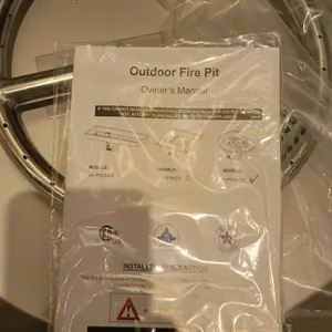 Unbranded USPY19-C-E round outdoor fire pit insert. Features a stainless steel drop-in pan and circular burner ring. Includes gas connection hose asse