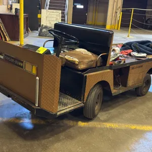 Taylor-Dunn electric warehouse maintenance cart. Features an onboard charger, 36V system, and diamond plate utility body. Note: Seat cushion is heavil