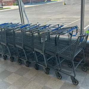 Metal wire shopping cart. Features a grey coated wire basket, blue plastic handle wrap, integrated child seat with safety strap, and a lower wire shel