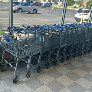 Metal wire shopping cart. Features a gray powder-coated wire basket, integrated child seat with safety restraint strap, and blue plastic handle wrap. 