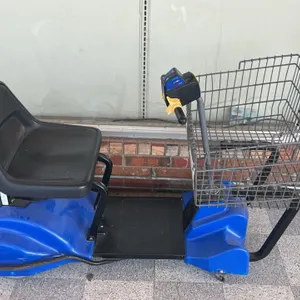 Mart Cart Handy Helper motorized shopping cart. Features a blue plastic body, black seat, and front wire basket with 'In-Store Use Only' signage. Equi
