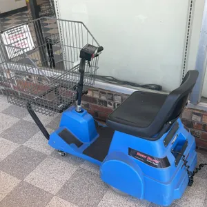 Carts and Parts, Inc. Handy Helper Electric Shopper motorized shopping cart. Features a blue plastic body, front-mounted wire basket, black vinyl seat