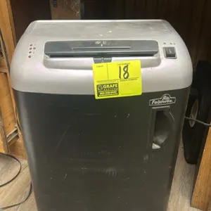 Fellowes SB-80 paper shredder. Features a pull-out wastebasket, top-mounted power switch, and status indicator lights. Mounted on casters. Electrical: