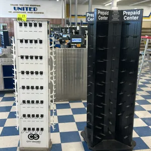 Assorted rotating merchandiser display lot. Includes (1) white NYS Life 'City Shades' rotating sunglasses display stand with integrated eyewear holder