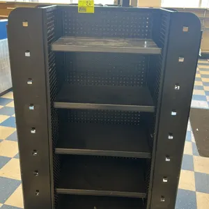 Portable candy and magazine display rack. Features multi-sided black metal construction with adjustable shelving, wire racks with product dividers, pe