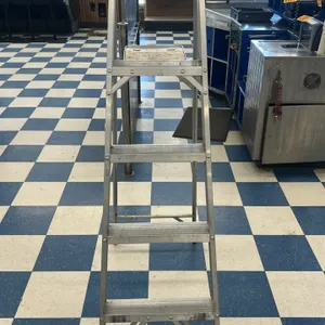 Davidson 5' aluminum step ladder. Features 4 slip-resistant steps, a red plastic top cap with integrated tool slots, and a fold-out utility tray.