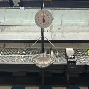 Detecto MCS Series portable hanging dial scale. Features a 20 lb. capacity double-sided dial and a stainless steel product pan with a bow hanger. Moun