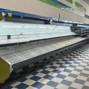 1992 Tyler F3VH12 84'L slanted produce case lineup. Consists of (7) 12'L open slanted refrigerated display cases. Features wire shelving and slanted g