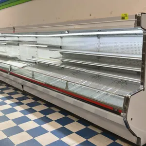 1992 Tyler DHMFG12 24' multi-tier open display case lineup. Features two 12' sections, solid adjustable shelving, pegboard backing, wire rack bottom d