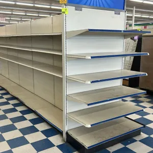 168'L of Lozier double-sided gondola shelving. Features 84"H uprights, 18"D and 16"D base shelves, and adjustable upper metal shelves. Off-white finis