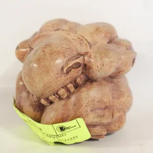 CURLED MAN WOOD CARVING