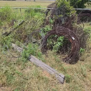 Assorted Barbed Wire Rolls and Wooden Post