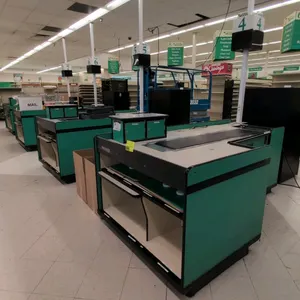 Reynolds Corporation UL-1 Series single belt checkout lane. Features a green and cream laminate finish, integrated motorized conveyor belt, cash drawe