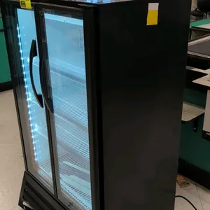 True TVM-30-HC~VM03 self-contained 2-door glass door merchandiser beverage cooler. Features black exterior, white interior, (2) glass display doors, a