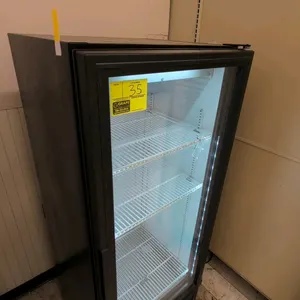 True GDM-12-HC-LD glass door merchandiser. Features single hinged glass display door, interior LED lighting, and three adjustable wire shelves with bo