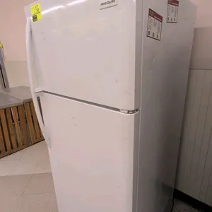 2018 Frigidaire FFHT1832TP0 self-contained top-freezer refrigerator. Features a white finish, glass refrigerator shelving, and door storage bins. S/N: