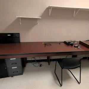 Office furniture package. Includes (3) assorted metal 2-drawer filing cabinets, (2) assorted wood 2-door cabinets, 132"L laminate countertop, black po