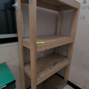 Unbranded wood 4-tier storage rack. Features a dimensional lumber frame, OSB shelf decks, and two side-mounted plastic utility brackets. 39"x18"x72".