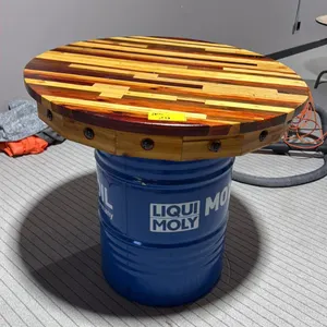 39" DIAMETER WOODEN TABLE TOP ON BLUE 50 GALLON OIL DRUM - APPROX. 3FT HIGH