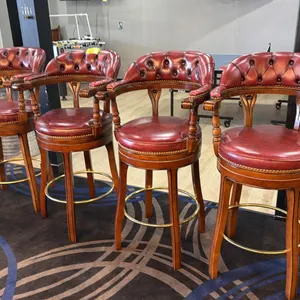 GROUP OF 4 BURGUNDY LEATHER UPHOLSTERED WOOD W/BRASS ACCENTS BAR STOOLS