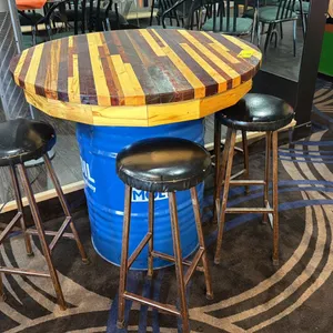 39" DIAMETER WOODEN TABLE TOP ON BLUE 50 GALLON OIL DRUM W/4 STOOLS - APPROX. 3FT HIGH