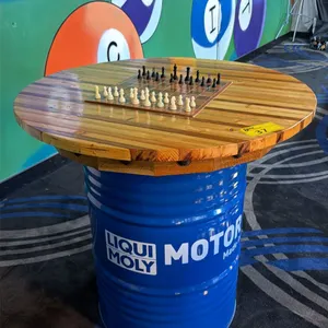 3FT DIAMETER WOODEN TABLE TOP ON BLUE 50 GALLON OIL DRUM W/CHESS SET - APPROX. 3FT HIGH
